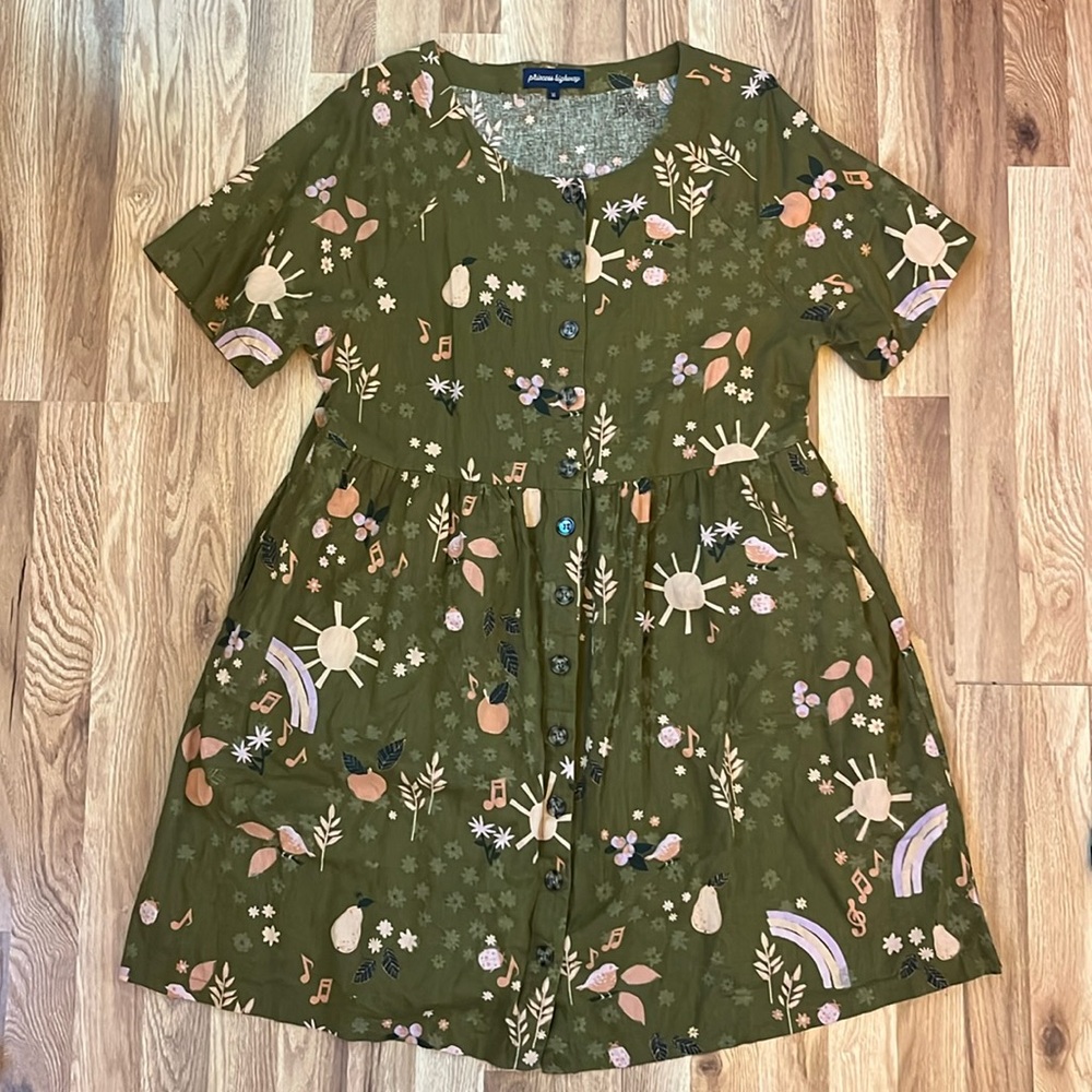 Beautiful vintage-style dress with whimsical pattern.
